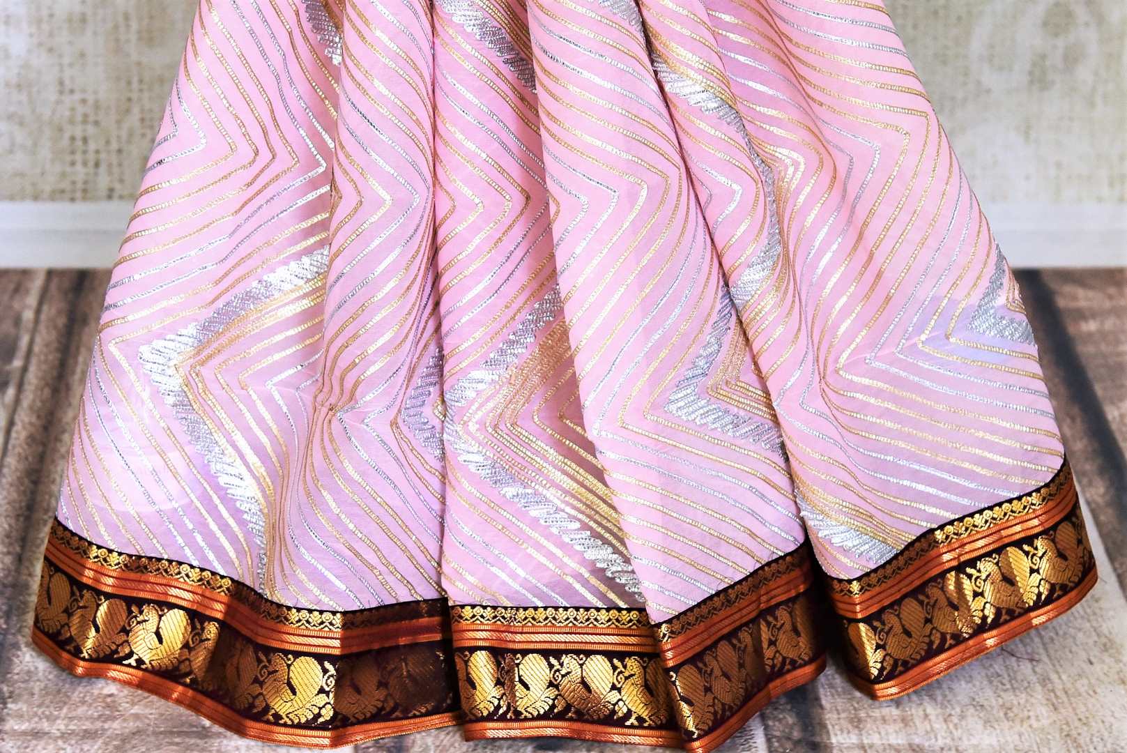 Buy beautiful powder pink georgette gota work Gadhwal saree online in USA. Keep your ethnic wardrobe up to date with latest designer sarees, pure silk sarees, handwoven sarees, tussar silk sarees, embroidered saris, Paithani sarees from Pure Elegance Indian saree store in USA.-pleats