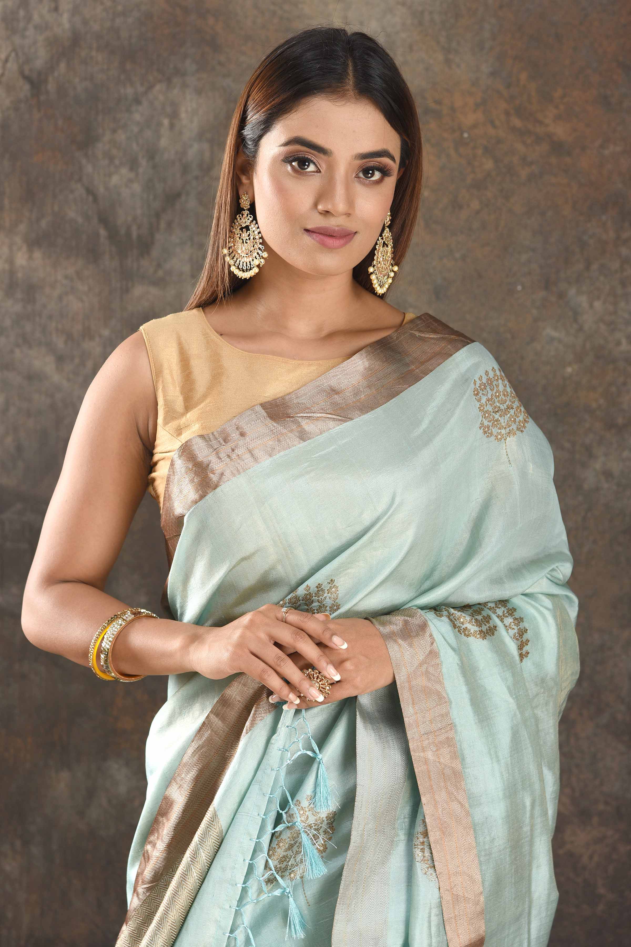 Shop stunning mint green muga silk saree online in USA with zari border. Be vision of elegance on special occasions in exquisite designer sarees, handwoven sarees, georgette sarees, embroidered sarees, Banarasi sarees from Pure Elegance Indian saree store in USA.-closeup