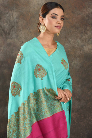 Shop stunning pastel blue Muga Banarasi sari online in USA with antique zari tree buta. Be vision of elegance on special occasions in exquisite designer sarees, handwoven sarees, georgette sarees, embroidered sarees, Banarasi saree, pure silk saris from Pure Elegance Indian saree store in USA.-closeup