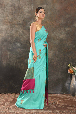 Shop stunning pastel blue Muga Banarasi sari online in USA with antique zari tree buta. Be vision of elegance on special occasions in exquisite designer sarees, handwoven sarees, georgette sarees, embroidered sarees, Banarasi saree, pure silk saris from Pure Elegance Indian saree store in USA.-side