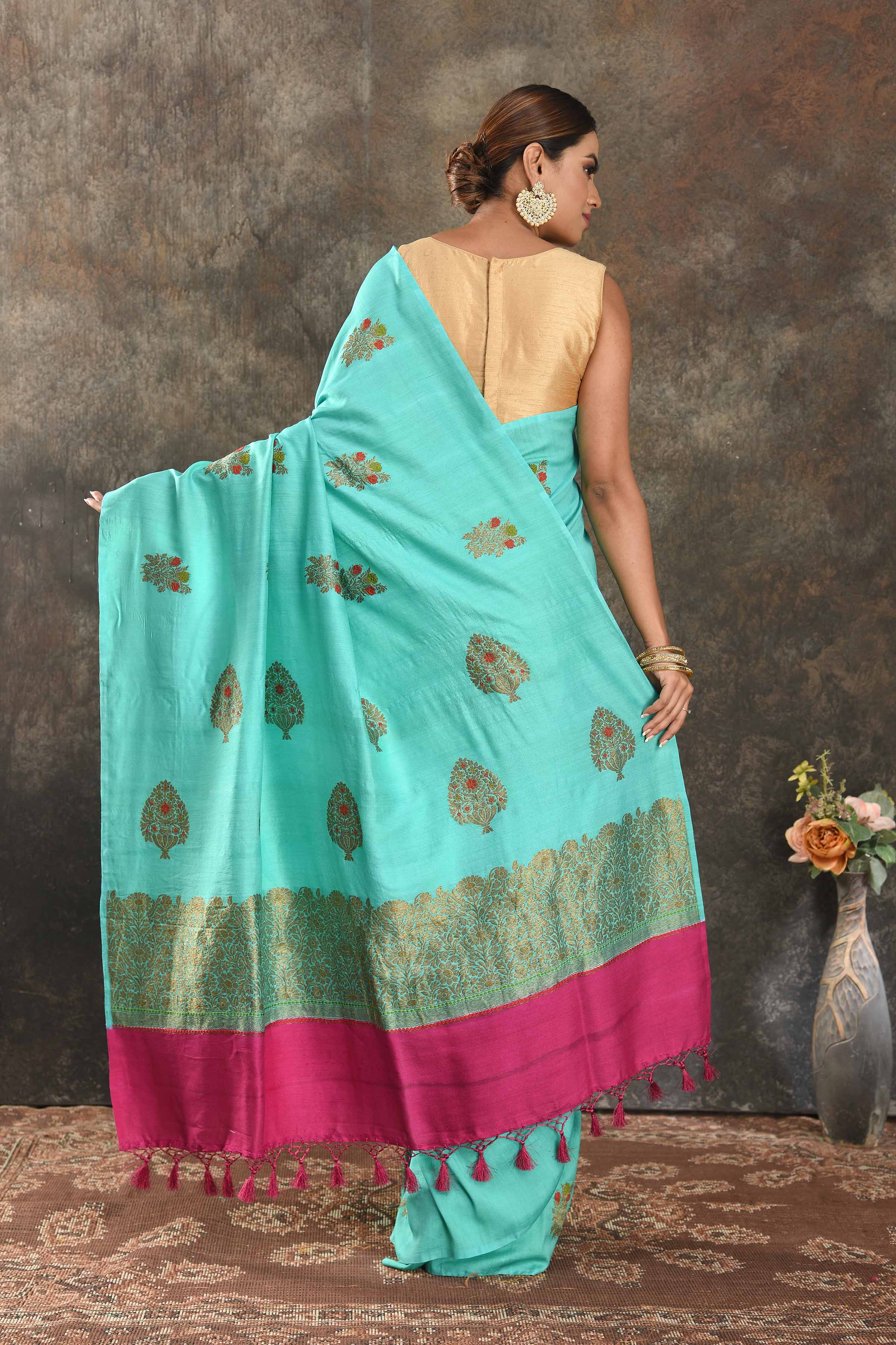 Shop stunning pastel blue Muga Banarasi sari online in USA with antique zari tree buta. Be vision of elegance on special occasions in exquisite designer sarees, handwoven sarees, georgette sarees, embroidered sarees, Banarasi saree, pure silk saris from Pure Elegance Indian saree store in USA.-back