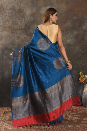 Buy royal blue tussar Banarasi sari online in USA with antiquqe zari buta. Be vision of elegance on special occasions in exquisite designer sarees, handwoven sarees, georgette sarees, embroidered sarees, Banarasi saree, pure silk saris from Pure Elegance Indian saree store in USA.-back