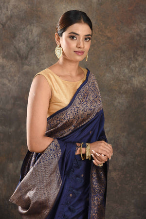 Shop beautiful dark blue tussar Banarasi saree online in USA with antique zari border. Be vision of elegance on special occasions in exquisite designer sarees, handwoven sarees, georgette sarees, embroidered sarees, Banarasi saree, pure silk saris, tussar sarees from Pure Elegance Indian saree store in USA.-closeup