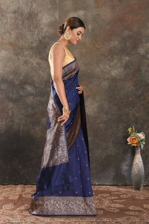 Shop beautiful dark blue tussar Banarasi saree online in USA with antique zari border. Be vision of elegance on special occasions in exquisite designer sarees, handwoven sarees, georgette sarees, embroidered sarees, Banarasi saree, pure silk saris, tussar sarees from Pure Elegance Indian saree store in USA.-side