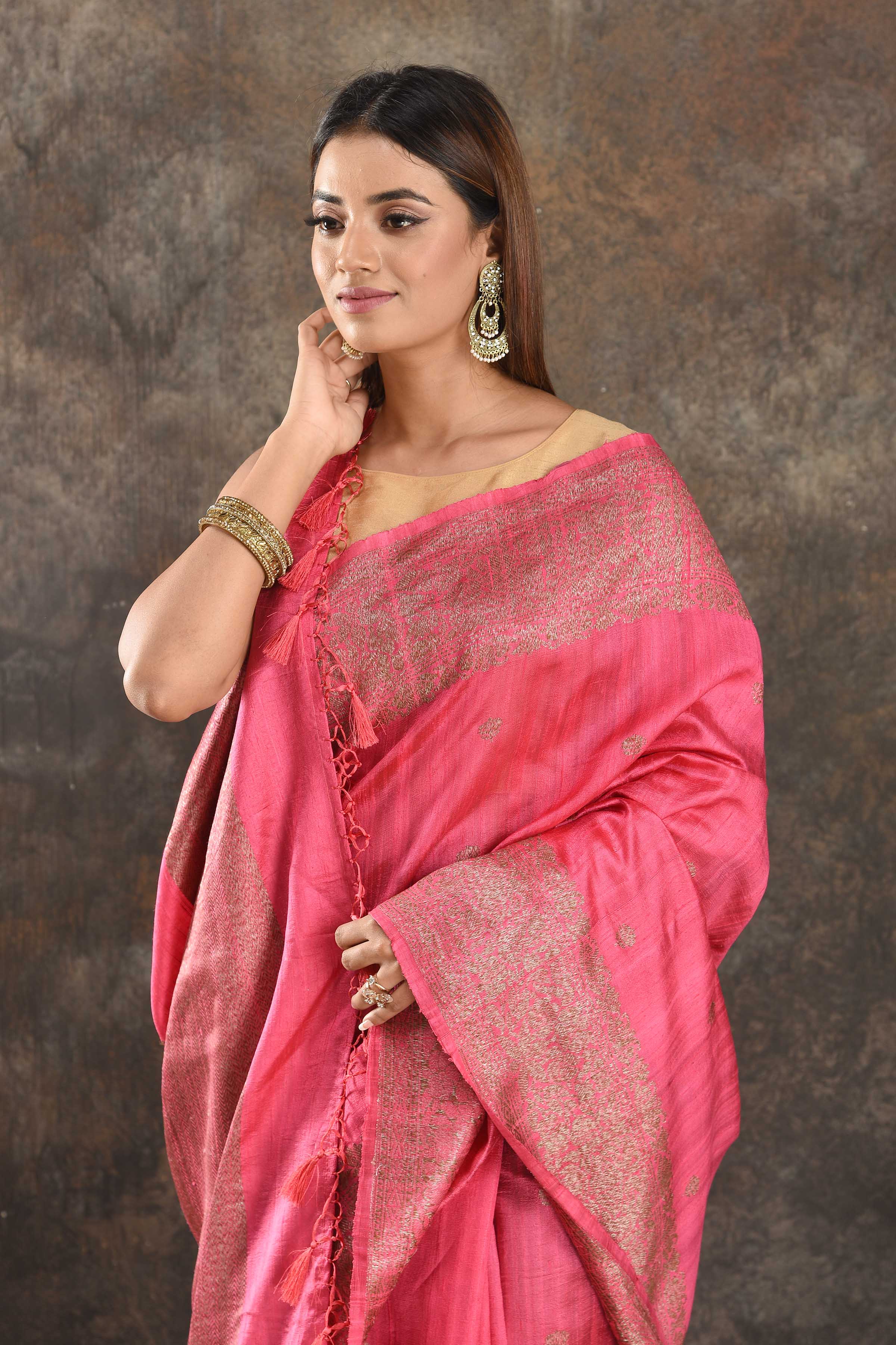 Buy beautiful pink tussar Banarasi saree online in USA with antique zari border. Be vision of elegance on special occasions in exquisite designer sarees, handwoven sarees, georgette sarees, embroidered sarees, Banarasi saree, pure silk saris, tussar sarees from Pure Elegance Indian saree store in USA.-closeup