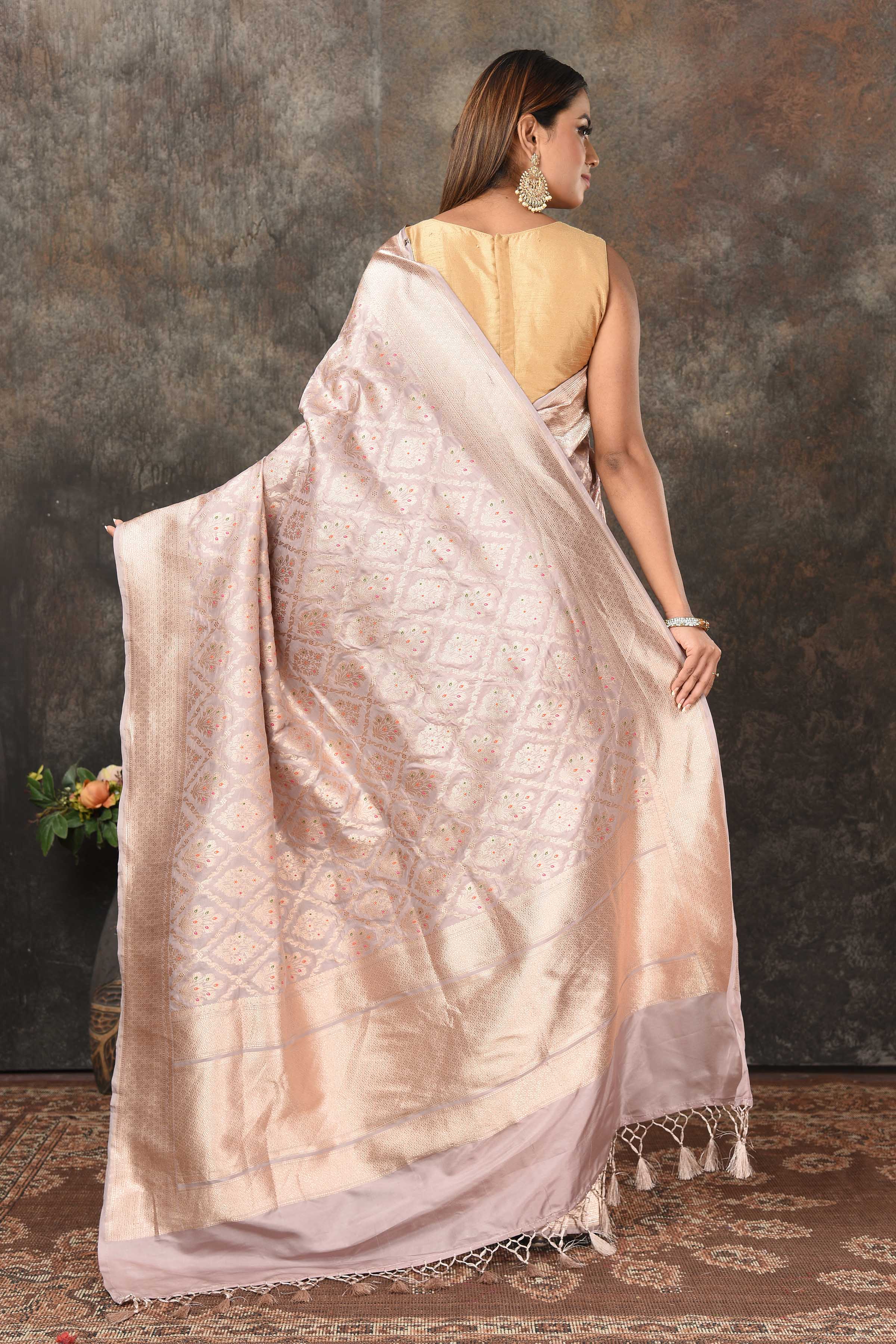 Shop light grey Banarasi sari online in USA with silver minakari zari work. Look royal at weddings and festive occasions in exquisite Banarasi saris, handwoven sarees, tussar silk sarees, Bollywood sarees, partywear sarees from Pure Elegance Indian saree store in USA.-back