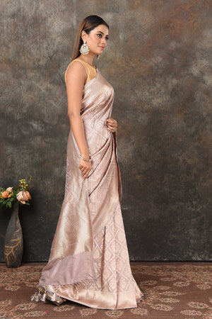 Shop light grey Banarasi sari online in USA with silver minakari zari work. Look royal at weddings and festive occasions in exquisite Banarasi saris, handwoven sarees, tussar silk sarees, Bollywood sarees, partywear sarees from Pure Elegance Indian saree store in USA.-side