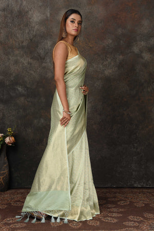 Shop stunning mint green Banarasi sari online in USA with overall zari work. Look royal at weddings and festive occasions in exquisite Banarasi saris, handwoven sarees, tussar silk sarees, Bollywood sarees, partywear sarees from Pure Elegance Indian saree store in USA.-side