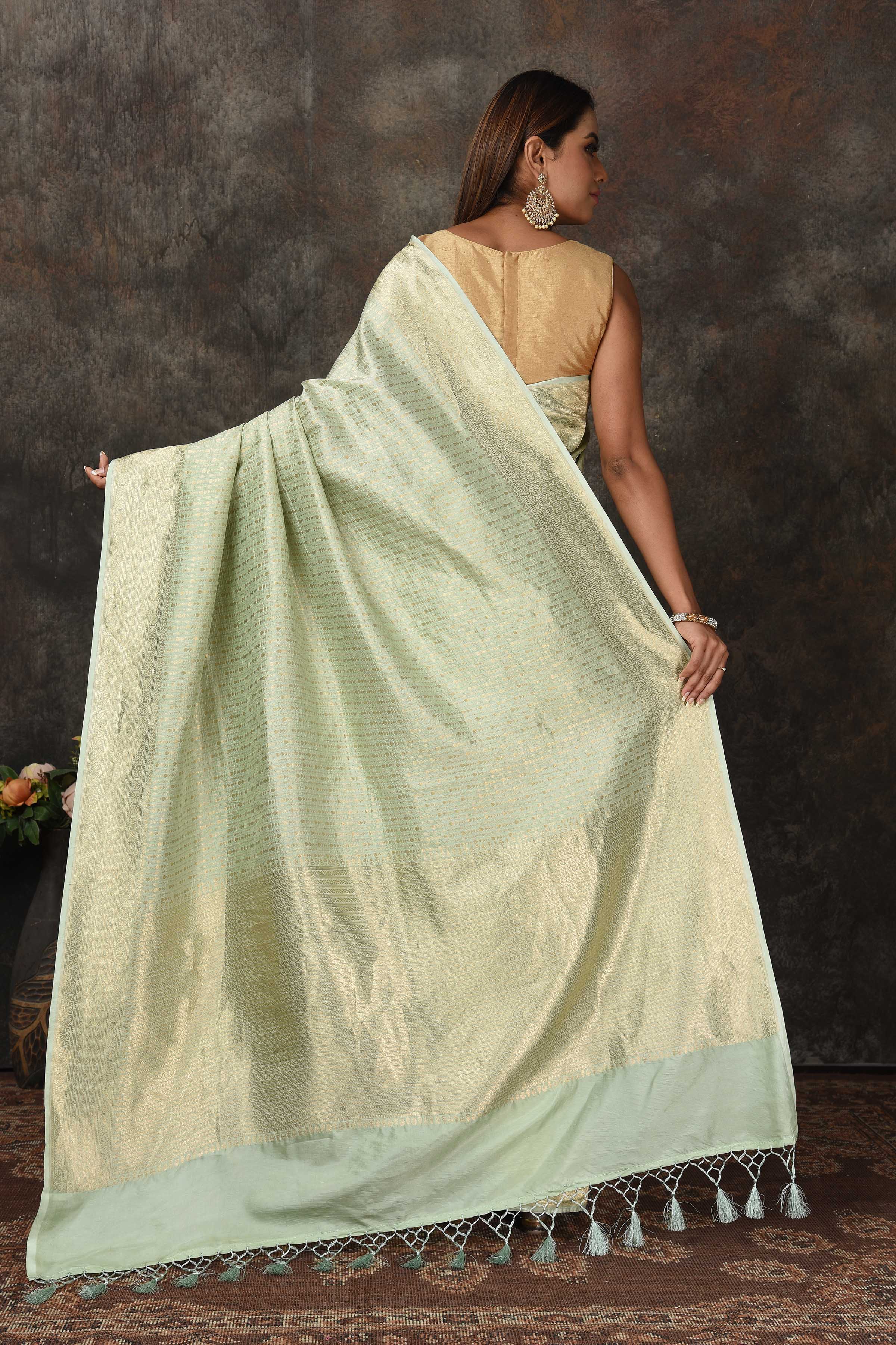 Shop stunning mint green Banarasi sari online in USA with overall zari work. Look royal at weddings and festive occasions in exquisite Banarasi saris, handwoven sarees, tussar silk sarees, Bollywood sarees, partywear sarees from Pure Elegance Indian saree store in USA.-back