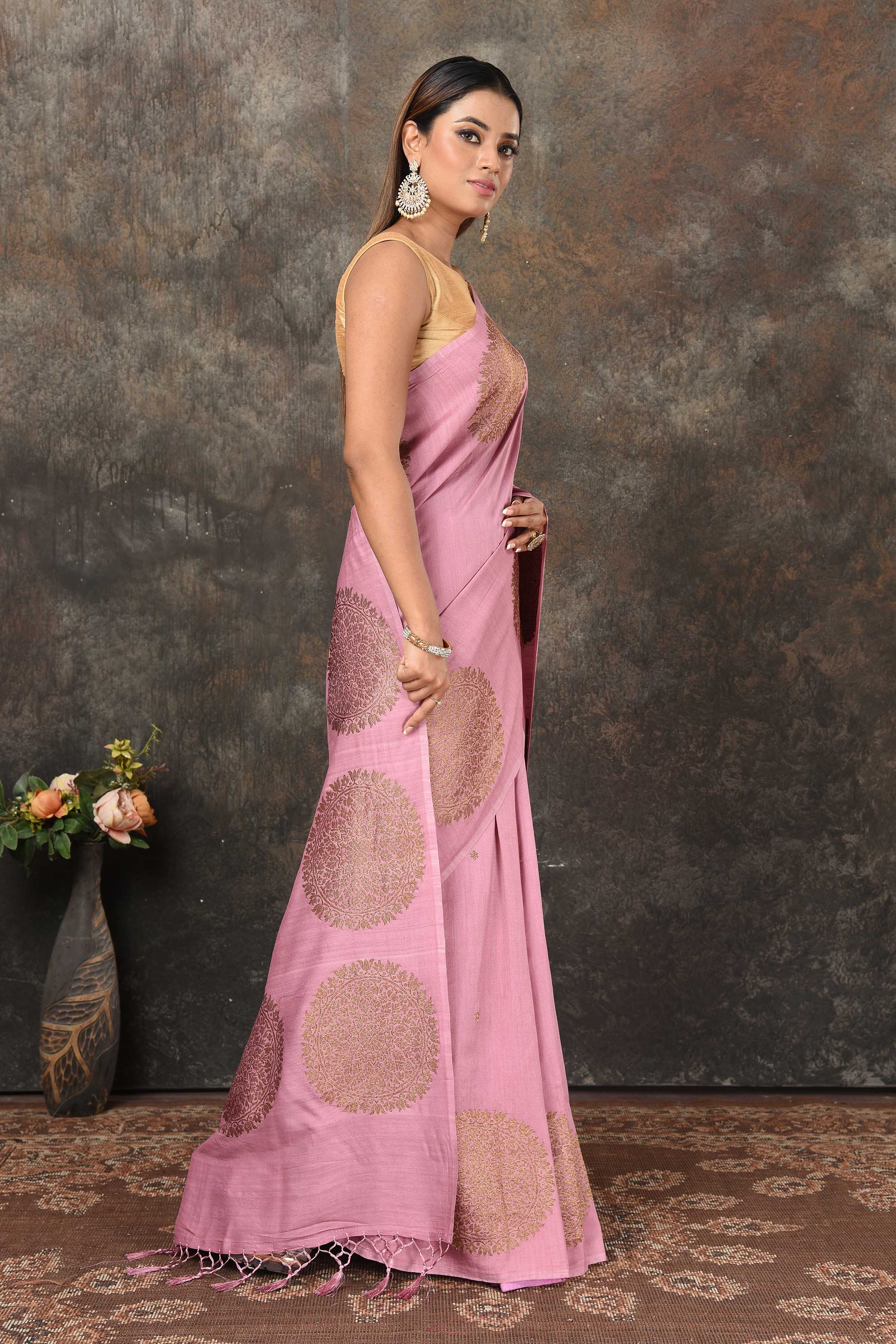 Shop onion pink Banarasi saree online in USA with antique zari motifs. Look royal at weddings and festive occasions in exquisite Banarasi saris, handwoven sarees, tussar silk sarees, Bollywood sarees, partywear sarees from Pure Elegance Indian saree store in USA.-side