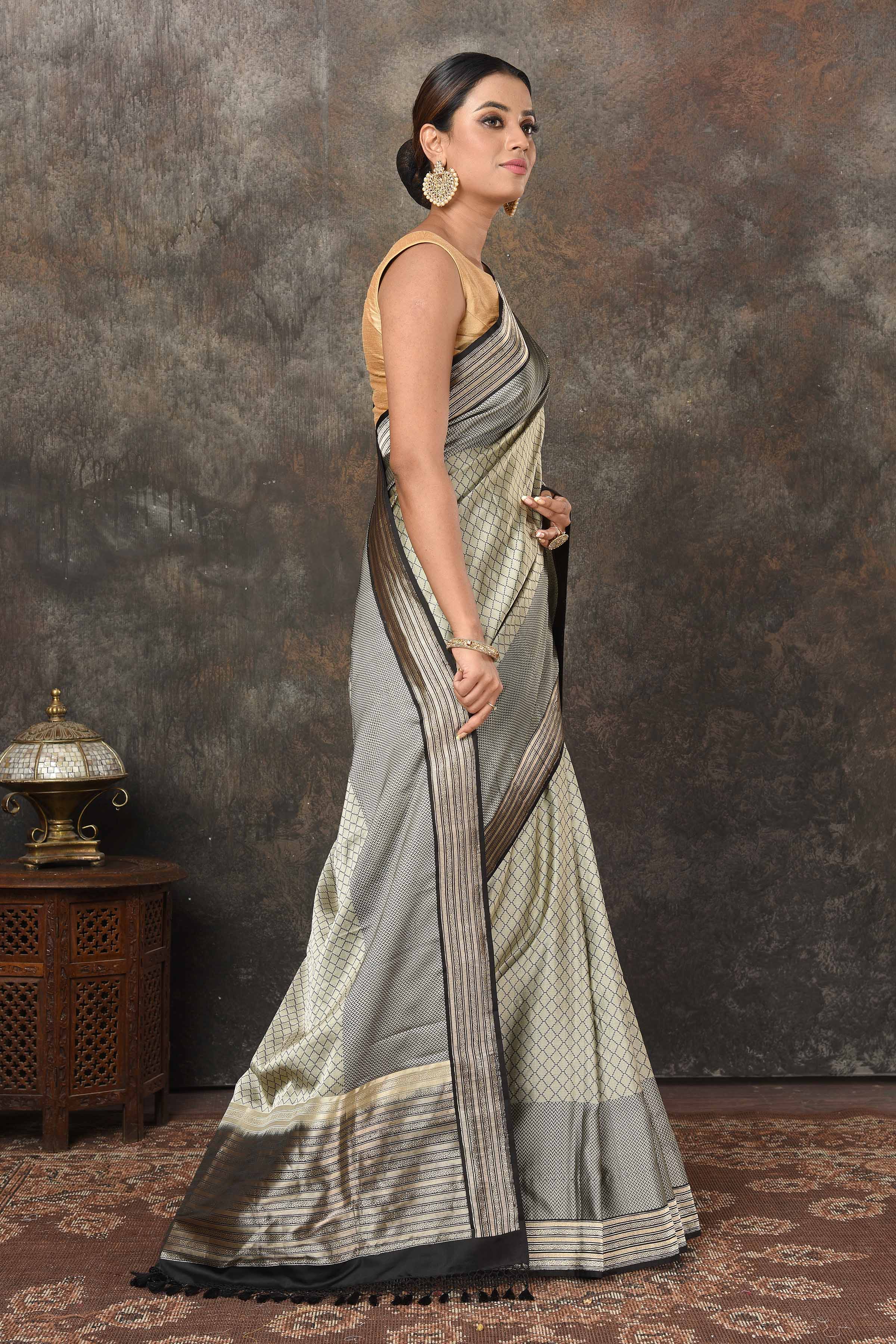 Shop stunning grey Mashru Banarasi  sari online in USA with silver zari border and pallu. Radiate elegance on special occasions in exquisite designer sarees, handwoven sarees, georgette sarees, embroidered sarees, Banarasi saree, pure silk saris, tussar sarees from Pure Elegance Indian saree store in USA.-side