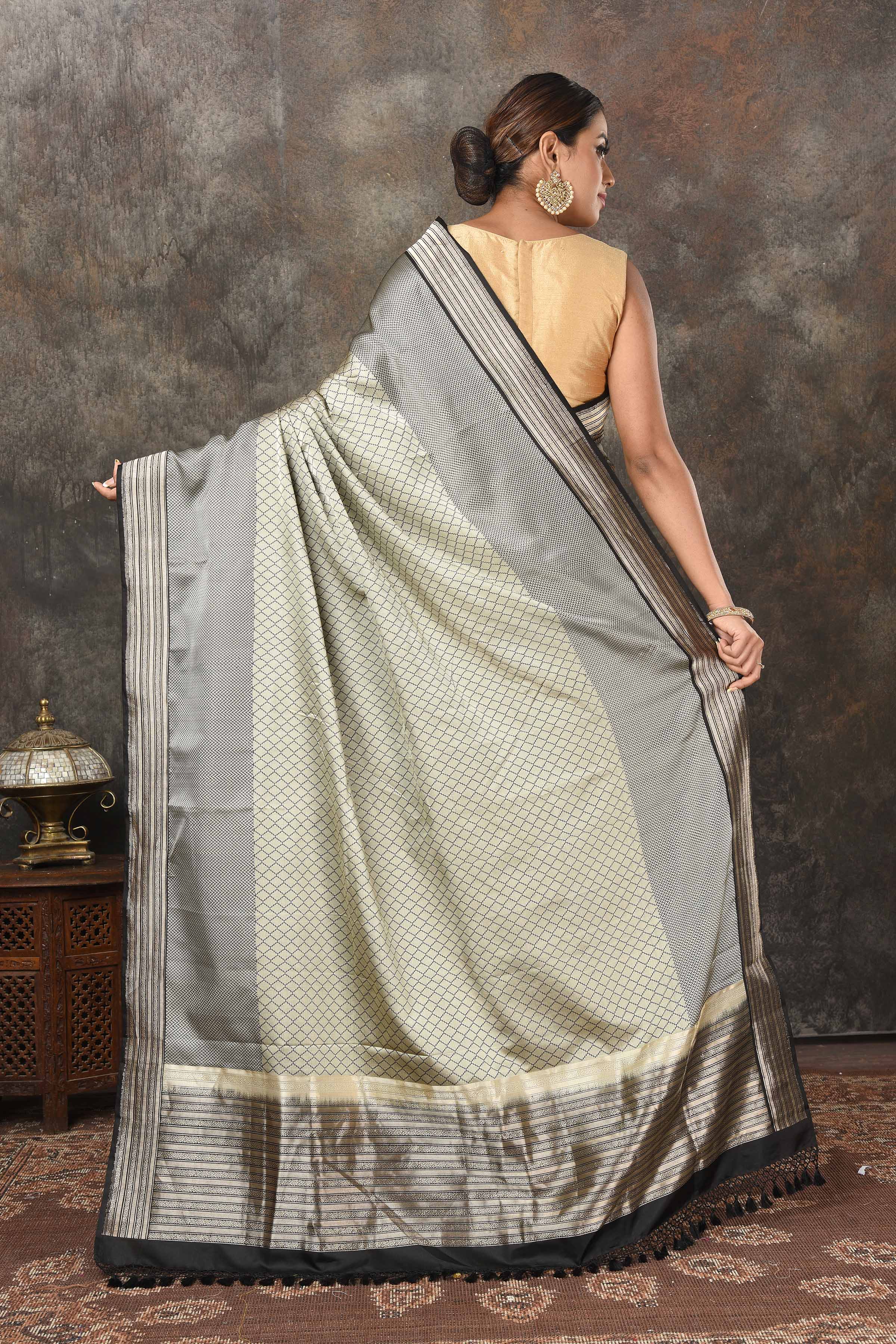 Shop stunning grey Mashru Banarasi  sari online in USA with silver zari border and pallu. Radiate elegance on special occasions in exquisite designer sarees, handwoven sarees, georgette sarees, embroidered sarees, Banarasi saree, pure silk saris, tussar sarees from Pure Elegance Indian saree store in USA.-back