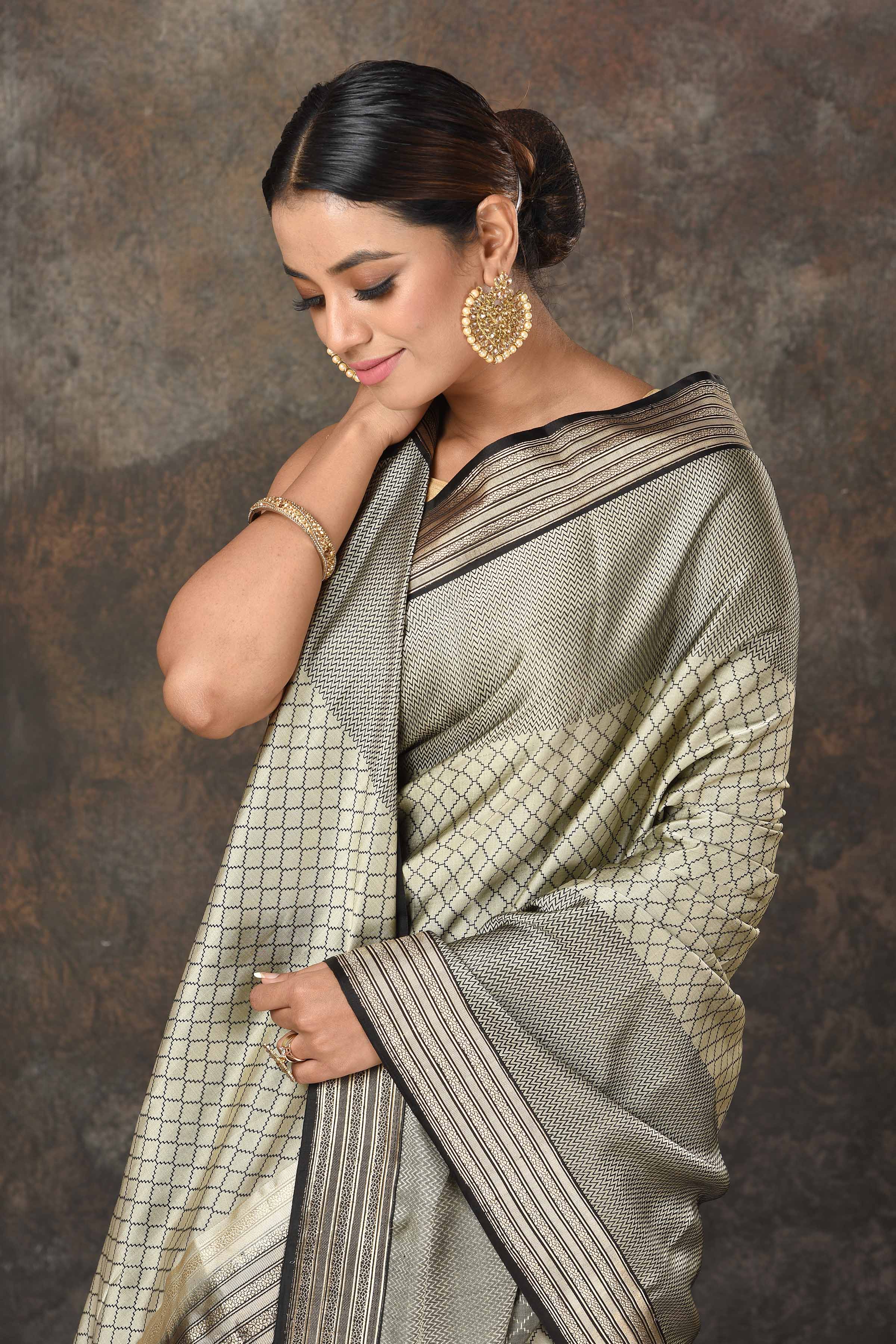 Shop stunning grey Mashru Banarasi  sari online in USA with silver zari border and pallu. Radiate elegance on special occasions in exquisite designer sarees, handwoven sarees, georgette sarees, embroidered sarees, Banarasi saree, pure silk saris, tussar sarees from Pure Elegance Indian saree store in USA.-closeup