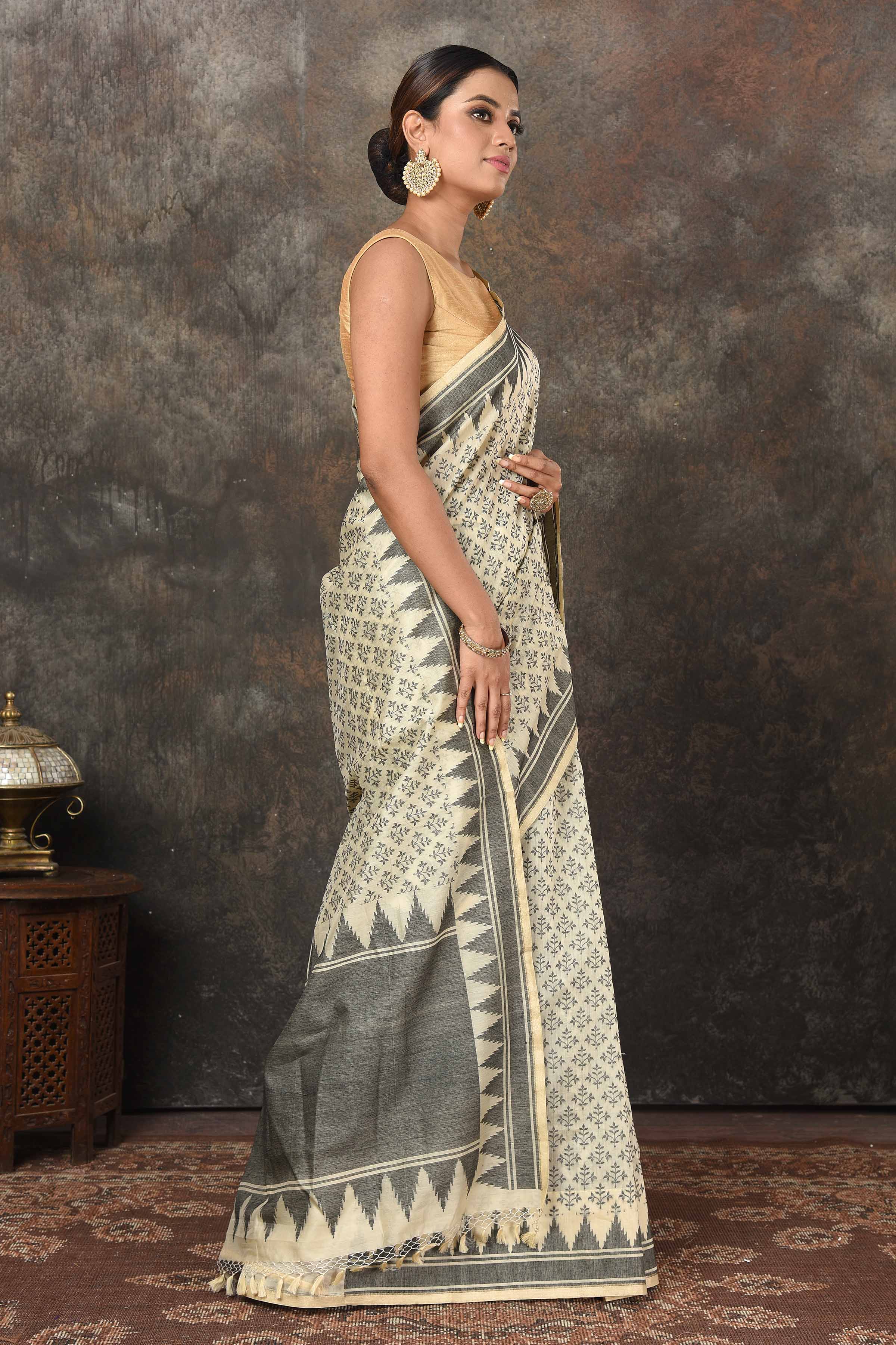 Buy elegant cream and grey Jamdani weave Banarasi saree online in USA. Radiate elegance on special occasions in exquisite designer sarees, handwoven sarees, georgette sarees, embroidered sarees, Banarasi saree, pure silk saris, tussar sarees from Pure Elegance Indian saree store in USA.-side