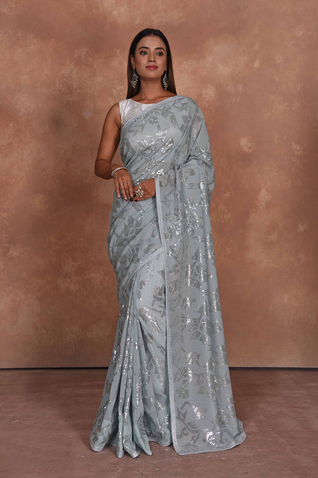 Buy stunning powder blue and silver sequin saree online in USA. Keep your ethnic wardrobe up to date with latest designer sarees, pure silk saris, Kanchipuram silk sarees, handwoven sarees, tussar silk saris, embroidered sarees, soft silk sarees from Pure Elegance Indian saree store in USA.-full view