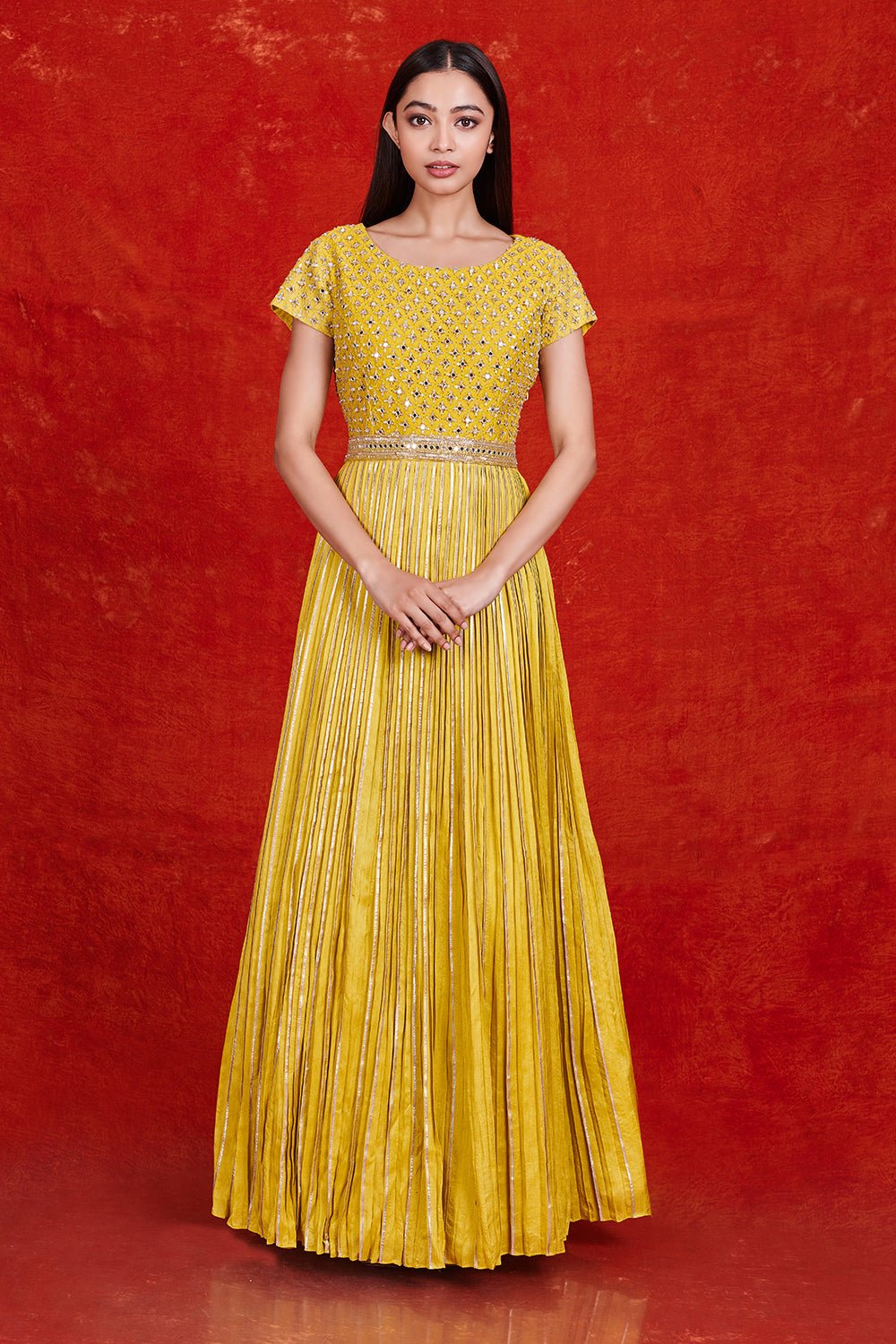 Buy gorgeous yellow fit and flare mirror work gown online in USA. Make a fashion statement on festive occasions and weddings with designer suits, Indian dresses, Anarkali suits, palazzo suits, designer gowns, sharara suits from Pure Elegance Indian fashion store in USA.-full view