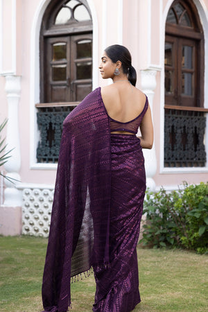 Shop a Beautiful wine sequin embroidered saree. It comes with a sequined work all over and a sleeveless sequined blouse. It is best suited for night parties & weddings. Make a fashion statement on festive occasions and weddings with designer sarees, designer suits, Indian dresses, Anarkali suits, palazzo suits, designer gowns, sharara suits, and embroidered sarees from Pure Elegance Indian fashion store in the USA.