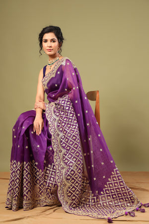 Buy purple organza silk saree online in USA with embroidered scalloped border. Make a fashion statement at weddings with stunning designer sarees, embroidered sarees with blouse, wedding sarees, handloom sarees from Pure Elegance Indian fashion store in USA.-side