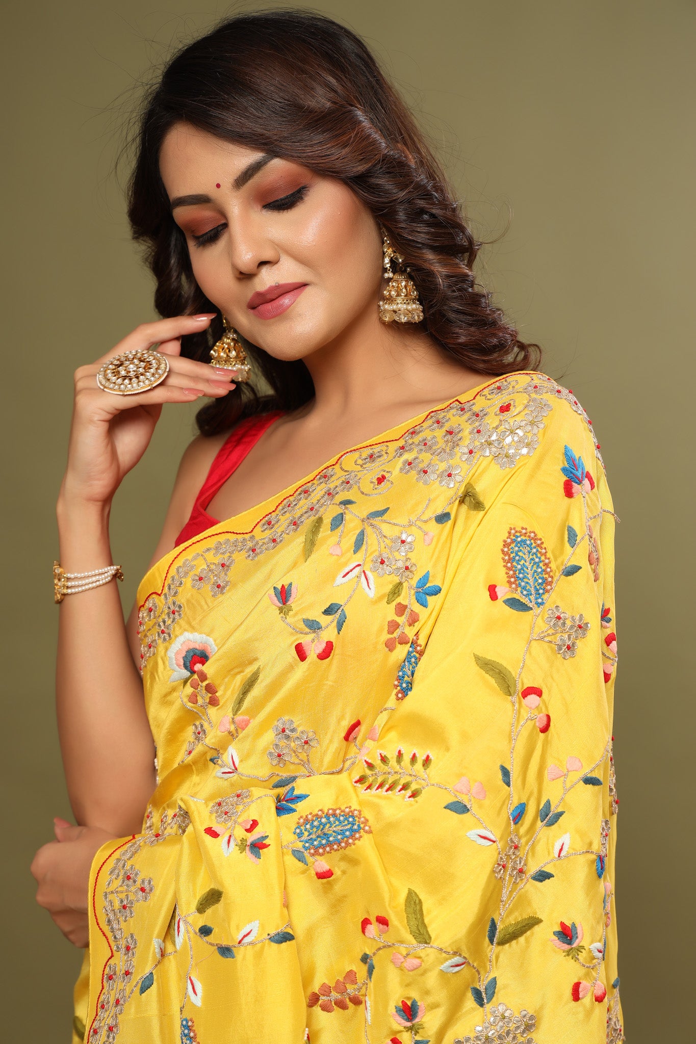 Buy yellow heavy embroidery tussar georgette sari online in USA. Make a fashion statement at weddings with stunning designer sarees, embroidered sarees with blouse, wedding sarees, handloom sarees from Pure Elegance Indian fashion store in USA.-closeup