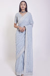 Shop blue crepe saree featuring a mirror and cut dana work, embroidered sleeves blouse detailing is a perfect choice for parties! It comes with a designer saree blouse. Make a fashion statement at weddings with stunning designer sarees, embroidered sarees with blouses, wedding sarees, and handloom sarees from Pure Elegance Indian fashion store in the USA.