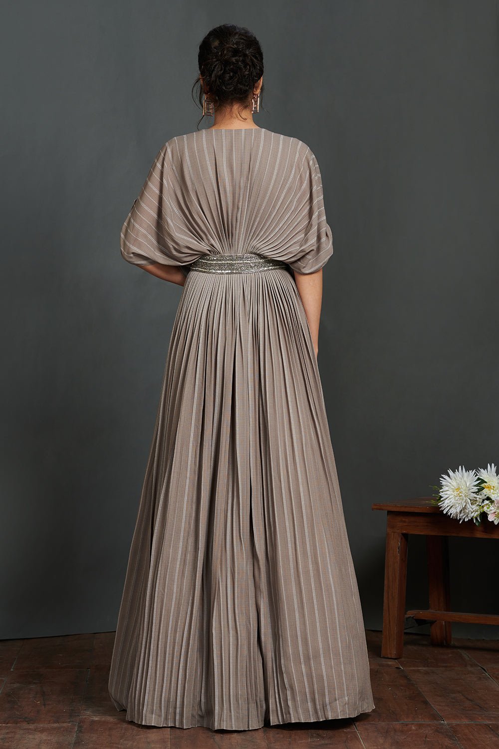 Buy beautiful grey pleated gown online in USA with metallic belt. Make a fashion statement on festive occasions and weddings with designer suits, Indian dresses, Anarkali suits, palazzo suits, designer gowns, sharara suits from Pure Elegance Indian fashion store in USA.-back