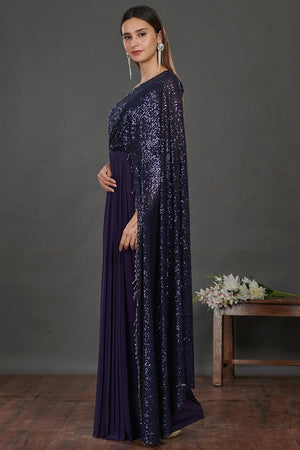 Buy stunning navy blue shimmery saree gown online in USA. Make a fashion statement on festive occasions and weddings with designer suits, Indian dresses, Anarkali suits, palazzo suits, designer gowns, sharara suits from Pure Elegance Indian fashion store in USA.-left