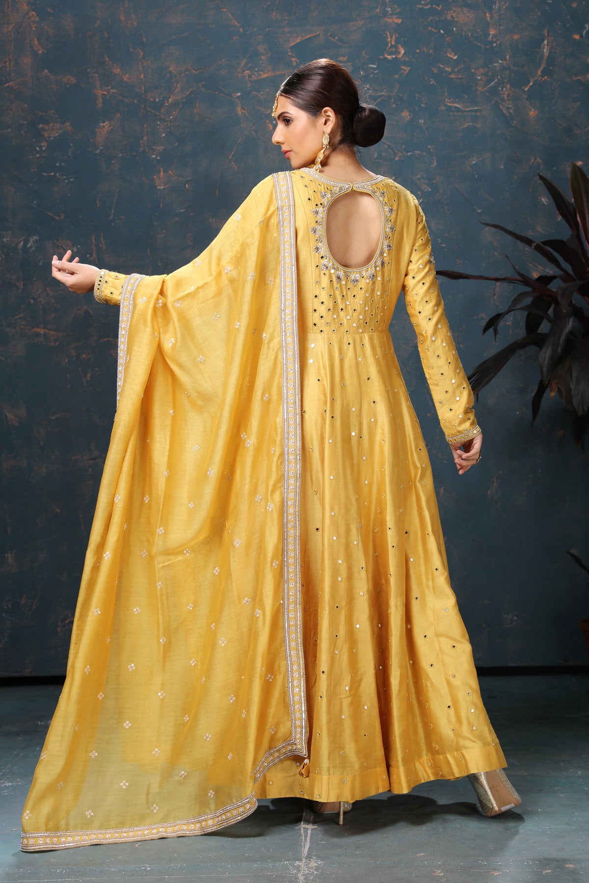 Buy beautiful yellow embroidered chanderi silk Anarkali suit online in USA with dupatta. Flaunt Indian style at parties and weddings in beautiful designer dresses, salwar suits, Anarkali suits, gowns, palazzo suits from Pure Elegance Indian fashion store in USA.-back